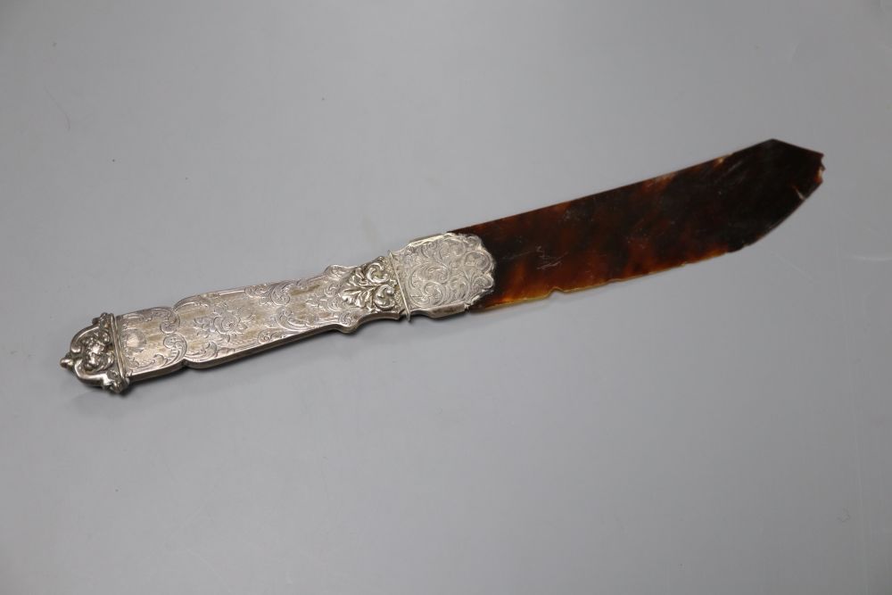 A Victorian silver handled tortoiseshell letter opener(a.f.) 25.6cm and a white metal and enamelled cigarette case, 83mm.